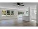 Modern kitchen with white shaker cabinets, stainless steel appliances, and a breakfast bar at 1021 Flagler Ave, Edgewater, FL 32132