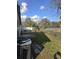 A view of the partially fenced back yard and patio at 1057 Inkberry Ct, Orlando, FL 32811