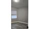This bedroom features modern gray walls and gray laminate flooring at 1057 Inkberry Ct, Orlando, FL 32811