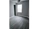 Cozy bedroom with hardwood floors, closet, and natural light at 1057 Inkberry Ct, Orlando, FL 32811