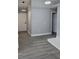 Hallway with Luxury Vinyl Plank flooring, leading to the front door at 1057 Inkberry Ct, Orlando, FL 32811