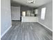 Open-concept living and dining room with hardwood floors and natural light at 1057 Inkberry Ct, Orlando, FL 32811
