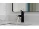 Modern bathroom sink with black faucet and quartz countertop at 1226 17Th St, Orange City, FL 32763