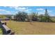 Large backyard with a wooden fence and open space at 13145 Paloma Rd, Clermont, FL 34711