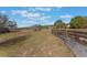 Large grassy backyard with wooden fence at 13145 Paloma Rd, Clermont, FL 34711