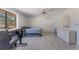 Bright bedroom with a large window, ceiling fan and dresser at 13145 Paloma Rd, Clermont, FL 34711