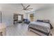 Spacious bedroom with large bed, ample closet space, and a window at 13145 Paloma Rd, Clermont, FL 34711