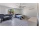 Comfortable bedroom with ceiling fan, large window, and ample closet space at 13145 Paloma Rd, Clermont, FL 34711