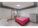 Bright bedroom with a queen-size bed and built-in dresser at 13145 Paloma Rd, Clermont, FL 34711