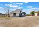 Two-story house with a gray roof and white siding, spacious yard at 13145 Paloma Rd, Clermont, FL 34711