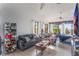 Bright main bedroom with a sitting area, large TV, and scenic views at 13145 Paloma Rd, Clermont, FL 34711