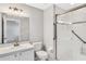 Bright bathroom featuring a glass-enclosed shower and white vanity at 1331 Common Way Rd, Orlando, FL 32814