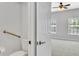 Accessible bathroom adjacent to bedroom featuring grab bars and updated fixtures at 1331 Common Way Rd, Orlando, FL 32814