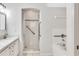 All-white bathroom featuring a shower and a soaking tub at 1331 Common Way Rd, Orlando, FL 32814