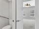 View from bathroom to Primary bedroom featuring carpet and ceiling fan at 1331 Common Way Rd, Orlando, FL 32814