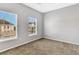 Neutral bedroom featuring two large windows and neutral carpeting at 1331 Common Way Rd, Orlando, FL 32814