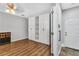 Bedroom featuring sleek wood floors and a closet for storage at 1331 Common Way Rd, Orlando, FL 32814
