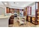 Bright kitchen with stainless steel appliances, center island, ample counter space and tile flooring at 1331 Common Way Rd, Orlando, FL 32814
