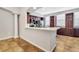 Bright open concept kitchen with quartz counters, stainless appliances and cherry cabinets at 1331 Common Way Rd, Orlando, FL 32814
