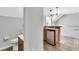 Open bar area with mini-fridge and overhead pendant lighting at 1331 Common Way Rd, Orlando, FL 32814