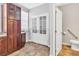 Spacious kitchen featuring cabinetry, tile floor, and a partial view of a nearby bathroom at 1331 Common Way Rd, Orlando, FL 32814