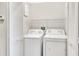 Convenient laundry room equipped with a washer and dryer at 1331 Common Way Rd, Orlando, FL 32814