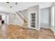 Bright living space features tile flooring, a staircase, and ample natural light at 1331 Common Way Rd, Orlando, FL 32814