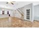 Inviting living room with tile flooring, staircase access, and neutral paint at 1331 Common Way Rd, Orlando, FL 32814