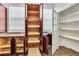 Spacious custom pantry cabinets providing ample storage, complimented by a convenient utility closet at 1331 Common Way Rd, Orlando, FL 32814