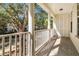 Charming porch with white pillars overlooks the neighborhood and offers ample natural light and privacy at 1331 Common Way Rd, Orlando, FL 32814