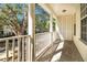 Charming porch with white pillars overlooks the neighborhood and offers ample natural light and privacy at 1331 Common Way Rd, Orlando, FL 32814