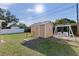Backyard with storage shed and a swing set at 1514 Doreen Ave, Ocoee, FL 34761