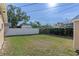 Large grassy backyard with a white fence at 1514 Doreen Ave, Ocoee, FL 34761