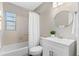 Clean bathroom with a white vanity and a shower/tub combo at 1514 Doreen Ave, Ocoee, FL 34761