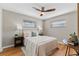 Well-lit bedroom, featuring a queen-size bed and wood-look floors at 1514 Doreen Ave, Ocoee, FL 34761