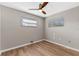 Bright bedroom with wood-look flooring and ceiling fan at 1514 Doreen Ave, Ocoee, FL 34761