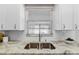 Modern kitchen sink and granite countertop at 1514 Doreen Ave, Ocoee, FL 34761