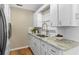 Renovated kitchen, white cabinets, granite counters at 1514 Doreen Ave, Ocoee, FL 34761
