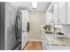 Modern kitchen with stainless steel appliances and granite countertops at 1514 Doreen Ave, Ocoee, FL 34761