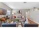 Living room with hardwood floors, neutral decor, and a comfy sofa at 1514 Doreen Ave, Ocoee, FL 34761
