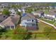Aerial view of the backyard with a screened-in patio and privacy fence at 15547 Hamlin Blossom Ave, Winter Garden, FL 34787
