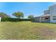 Large backyard with a screened-in patio and well-maintained lawn at 15547 Hamlin Blossom Ave, Winter Garden, FL 34787