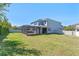 Spacious backyard with a screened-in patio and privacy fence at 15547 Hamlin Blossom Ave, Winter Garden, FL 34787