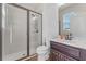 Bathroom with a walk-in shower featuring subway tile and a glass door at 15547 Hamlin Blossom Ave, Winter Garden, FL 34787