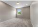 Cozy bedroom featuring plush carpet, a window with natural light, and neutral color palette at 15547 Hamlin Blossom Ave, Winter Garden, FL 34787