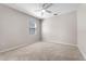 Comfortable bedroom with carpet, ceiling fan, and a window at 15547 Hamlin Blossom Ave, Winter Garden, FL 34787