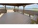 Covered dock interior showcasing built-in benches and a peaceful lake view at 15547 Hamlin Blossom Ave, Winter Garden, FL 34787