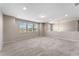 Bright loft area with large windows and plush carpeting at 15547 Hamlin Blossom Ave, Winter Garden, FL 34787
