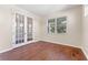 Bright office space with wood-look floors, complemented by white trim and French doors at 15547 Hamlin Blossom Ave, Winter Garden, FL 34787