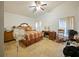 Bright bedroom with vaulted ceiling, fan, tile flooring and ample natural light at 1614 Stanbury Dr, Orlando, FL 32818